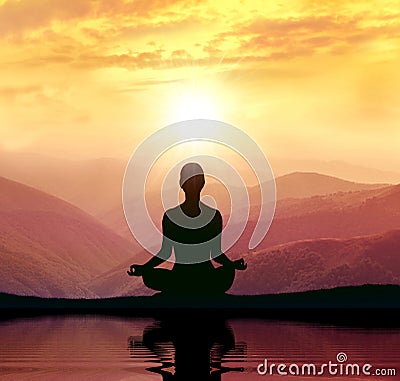 Yoga and meditation. Silhouette in the mountain Stock Photo