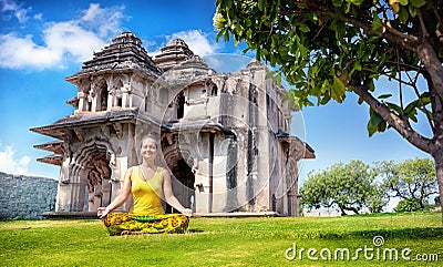 Yoga near Lotus Mahal in Hampi Stock Photo