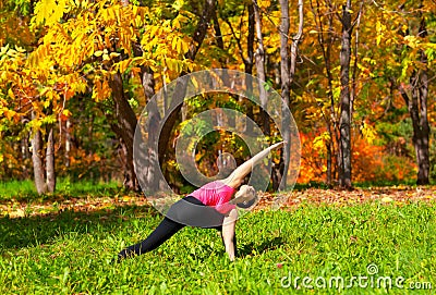 Yoga parivrita parshvakonasana pose Stock Photo