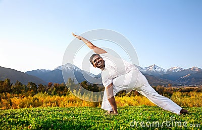 Yoga parivrita parsvakonasana Stock Photo