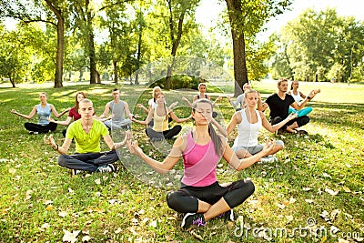 Yoga in park Stock Photo