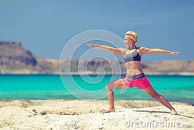 Yoga pose, fit woman exercise on beach Stock Photo