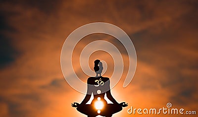 Yoga position silhouette in contrasting sun, Sacral chakra Stock Photo