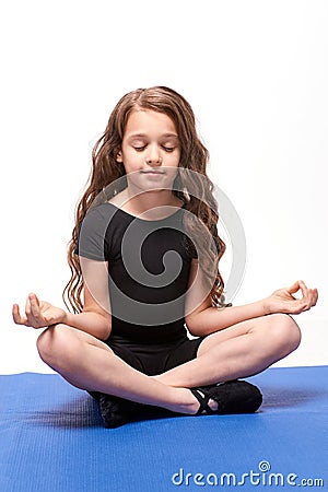 Yoga practice. Little girl. Lotus position Stock Photo