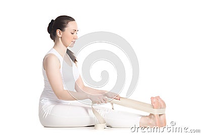 Yoga with props, paschimothanasana Stock Photo