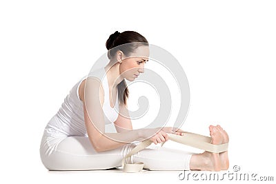 Yoga with props, seated forward bend pose Stock Photo