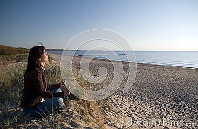 Yoga at sea Stock Photo