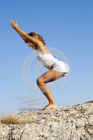 Yoga seria: Called Chair Pose Stock Photo