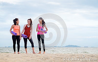 yoga student talking after finish outdoor beach training class,Healthy balance lifestyle sport concept Stock Photo