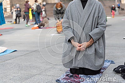 Yoga teachers protesting against the blockade and restrictions of Covid-19 in a square in Brescia, Italy. Man dressed fashion Stock Photo