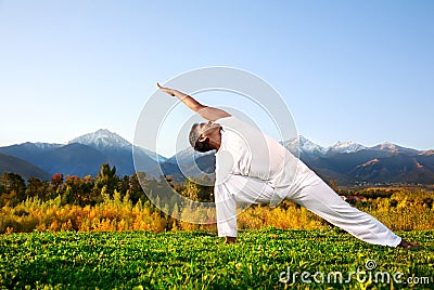 Yoga triangle pose Stock Photo