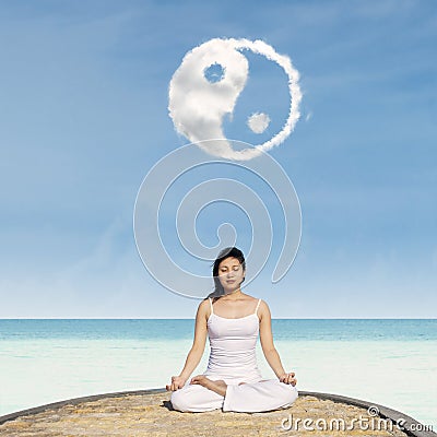 Yoga under Yin Yang cloud Stock Photo