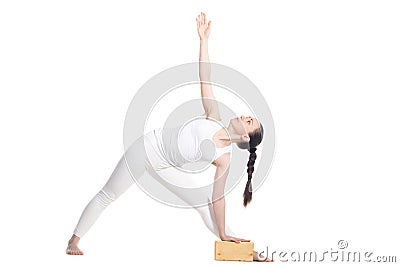 Yoga Utthita Trikonasana Pose with props Stock Photo