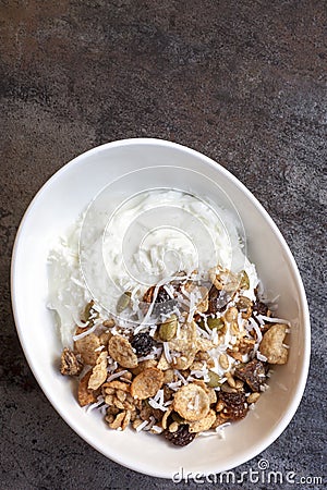 Yoghurt muesli or yogurt granola with coconut. Stock Photo