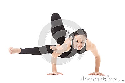 Yogi female in yoga asana Parivritta Eka Pada Koundinyasana Stock Photo