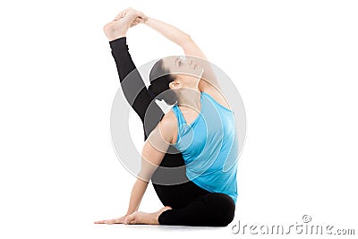 Yogi female in yoga asana Parivritta Surya Yantrasana, Compass P Stock Photo