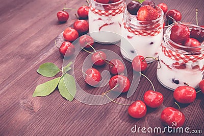 Yogurt with Cherry and strawberries, square. Stock Photo