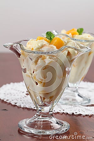 Yogurt dessert with peaches Stock Photo