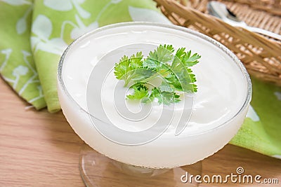 Yogurt with leaf in glass Stock Photo