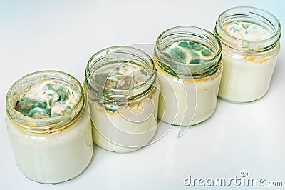 Yogurt with mold in glass container in laboratory Stock Photo