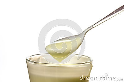 Yogurt scoop in a glass cup Stock Photo