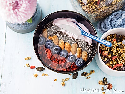 Yogurt smoothie bowl with berries, chia, granola Stock Photo