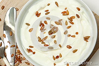 Yogurt with Sunflower Seeds on Table High Angle View Stock Photo