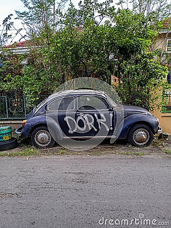 Abandoned Volkswagen Beetle on the side of the road Editorial Stock Photo