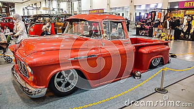 Modified classic orange Chevrolet 3100 Task Force truck Editorial Stock Photo