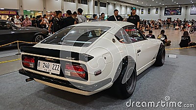 Modified white Nissan Fairlady z or datsun 240z quarter rear view Editorial Stock Photo