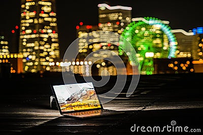 Yokohama night view and a laptop Nomad worker of the image Stock Photo