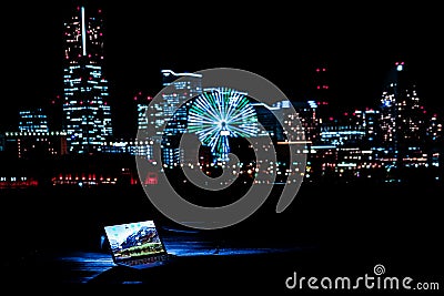 Yokohama night view and a laptop Nomad worker of the image Stock Photo