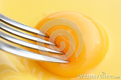 Yolk with fork Stock Photo