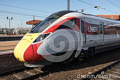 LNER Azuma train on a platform waiting to depart. Editorial Stock Photo