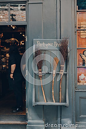 York, UK - June 22, 2021: Park your broom display outside Facade of The Shop That Must Not Be Named, a Harry Potter themed shop on Editorial Stock Photo