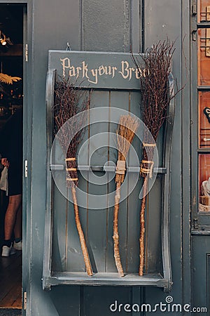 York, UK - June 22, 2021: Park your broom display outside Facade of The Shop That Must Not Be Named, a Harry Potter themed shop on Editorial Stock Photo