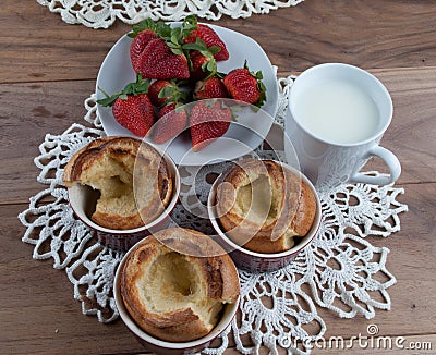 Yorkshire pudding in ceramic ramekin and strawberry Stock Photo