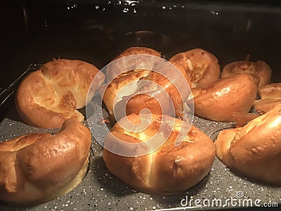 Yorkshire puddings ready to come out of the oven Stock Photo