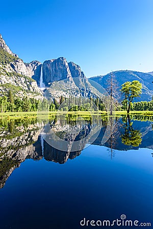 Yosemite National Park - Reflection in Merced River of Yosemite waterfalls and beautiful mountain landscape, California, USA Stock Photo