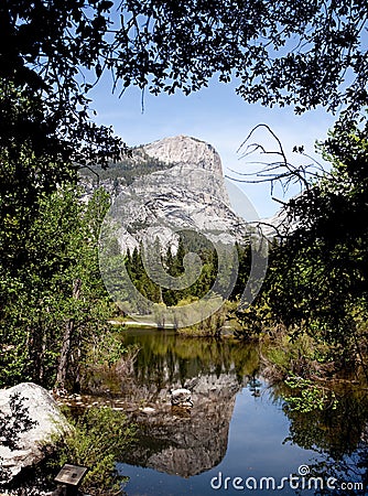 Yosemite rocks reflected in Mirror Lake Stock Photo