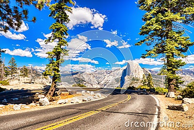 Yosemite Valley Road to Glacier Point with Half Dome at Background during a Sunny Day, Yosemite National Park Stock Photo