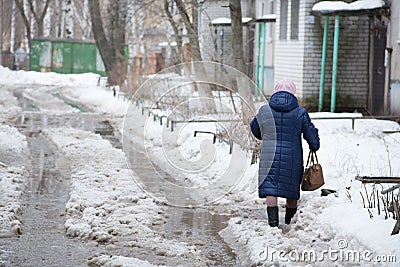 Deep puddle with lumps snow Editorial Stock Photo