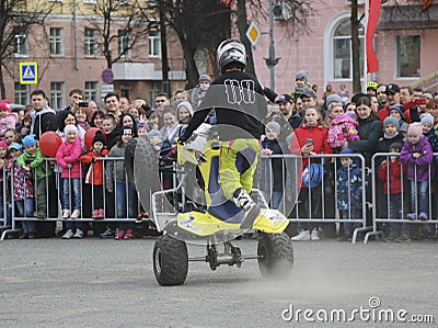 YOSHKAR-OLA, RUSSIA - MAY 5, 2018: AutoMotoshow in square. Tricks on ATV StuntRiding Wheelie, Stoppie and Akrobatyka on quad bike. Editorial Stock Photo