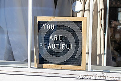 You are beautiful sign in a window Stock Photo