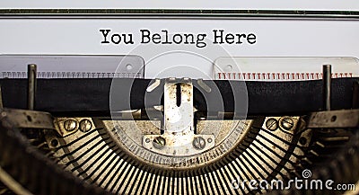 You belong here symbol. Words `You belong here` typed on retro typewriter. Diversity, inclusion, belonging and you belong here Stock Photo