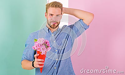 This is for you Boyfriend happy holds bouquet flowers. Man ready for romantic date bring bouquet pink flowers. Macho Stock Photo