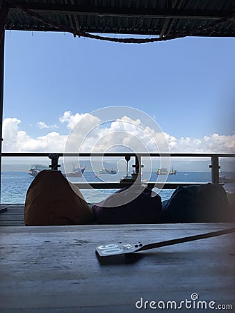 Views of the sea and mountains and ships. sun osing beach - Banyuwangi - East Java - Indonesia Stock Photo