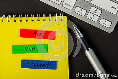 Are you covered - message on insurer or underwriter workplace. Insurance concept Stock Photo