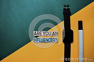 Are You An Influencer? text on top view color table background Stock Photo