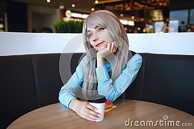 Youbg atteractive girl at cafe at the table alone Stock Photo